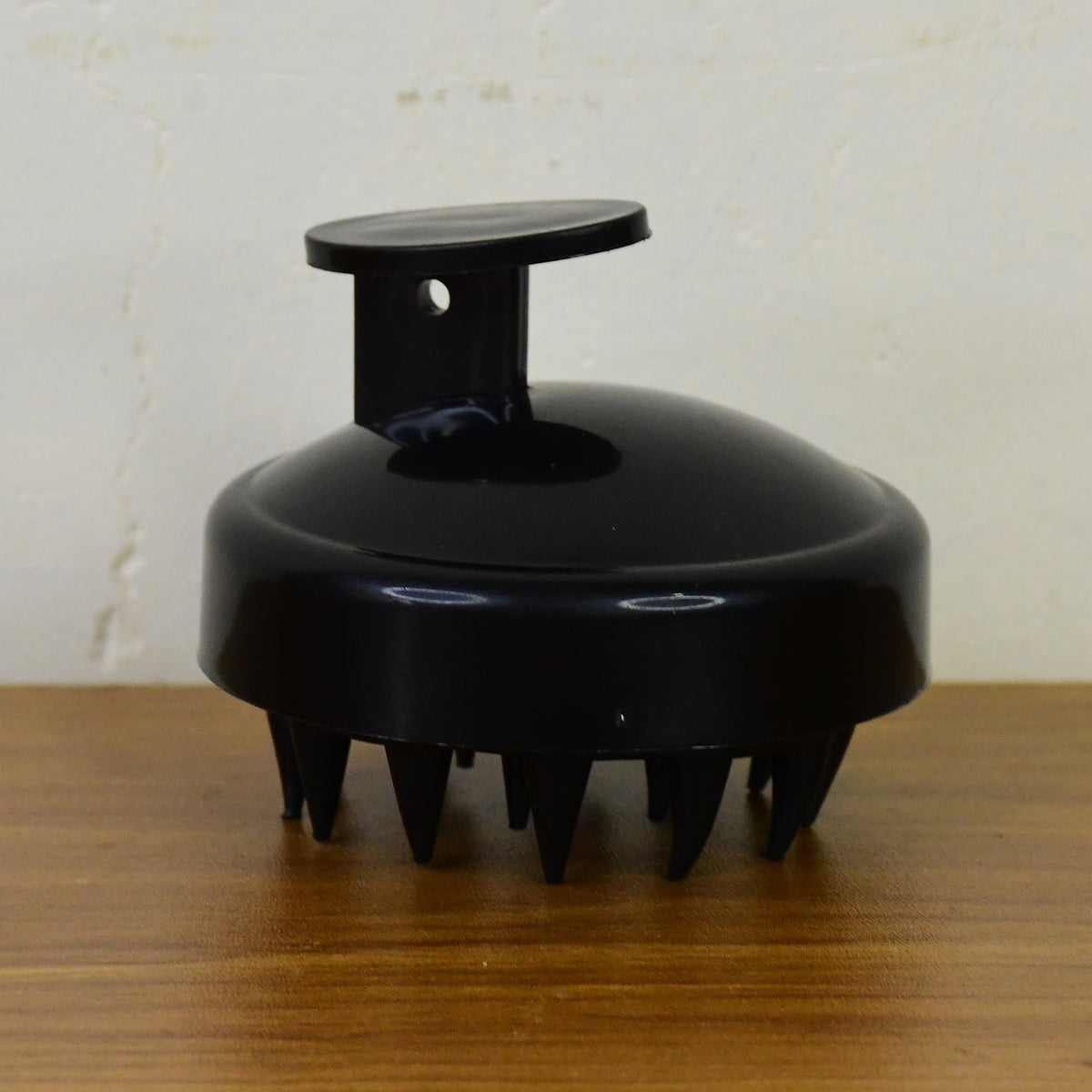 Scalp massager brush styled with hair care products